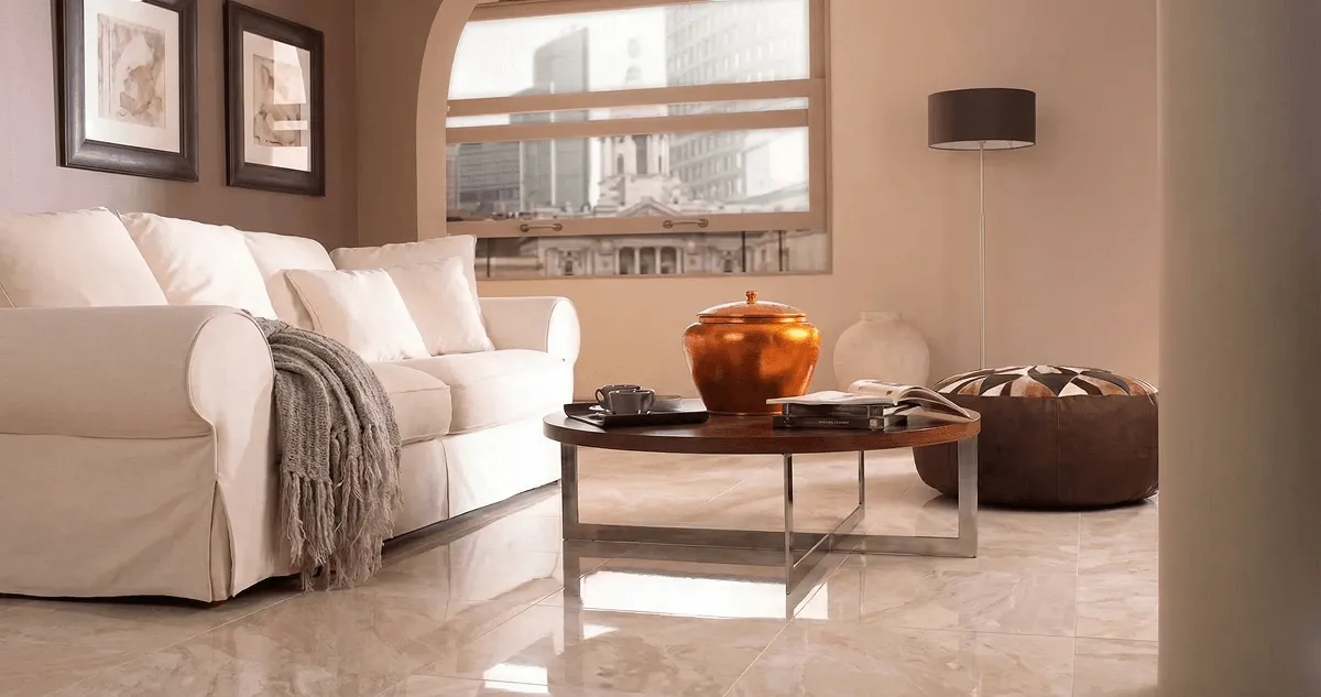Modern living room with professionally installed marble flooring, a beige sofa, coffee table in Kansas City, KS