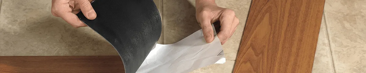 A professional installing vinyl flooring in Kansas City, KS